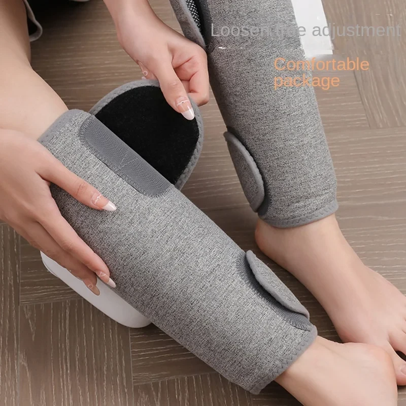 Hands securing the adjustable overlapping wrap around a calf with the hook-and-loop closure.