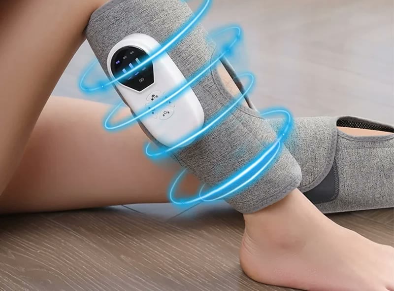 Wrap worn on a calf with a visualization of air compression waves around the leg.